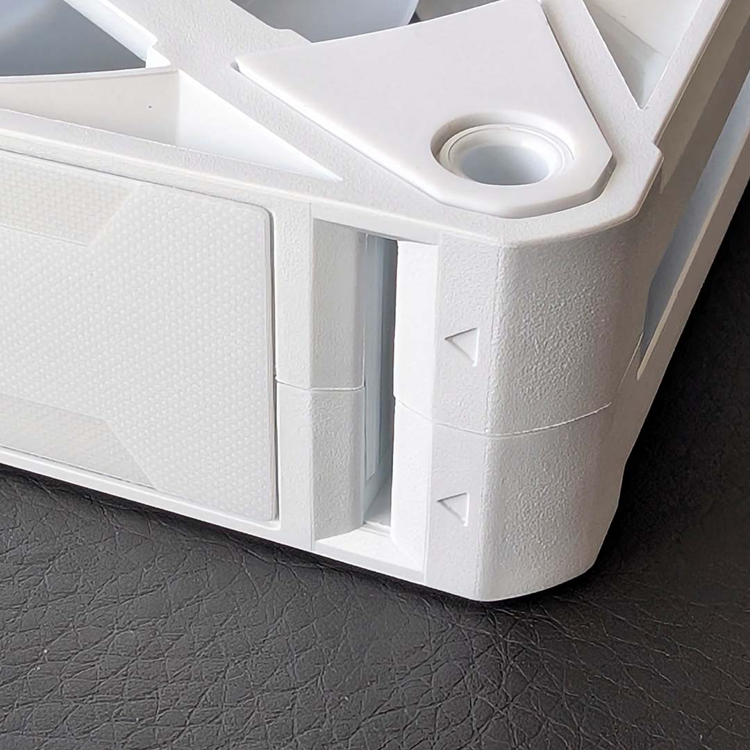 A close-up of an input cable port on an Arctic Bionix A-RGB fan.