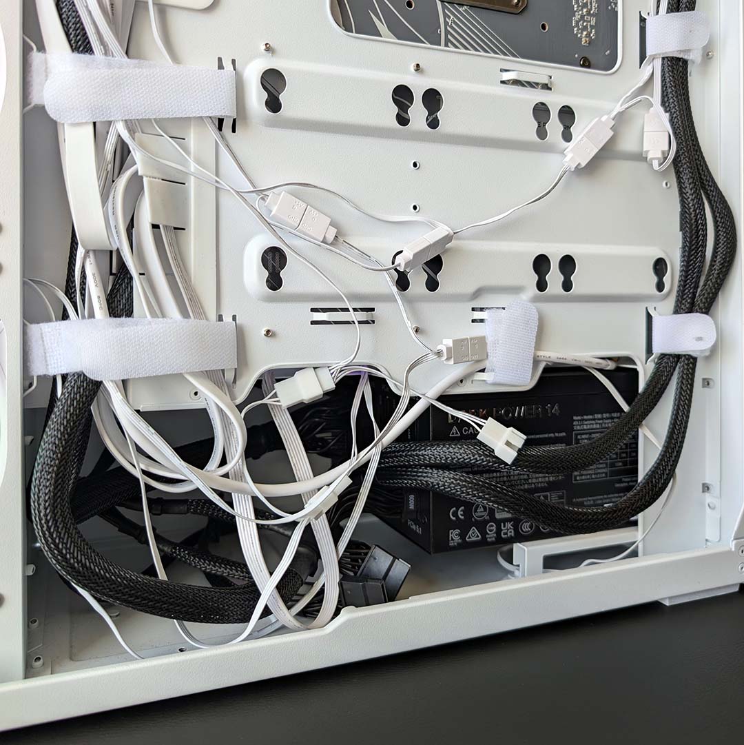 A close-up of messy cable management inside the Arctic Xtender VG.