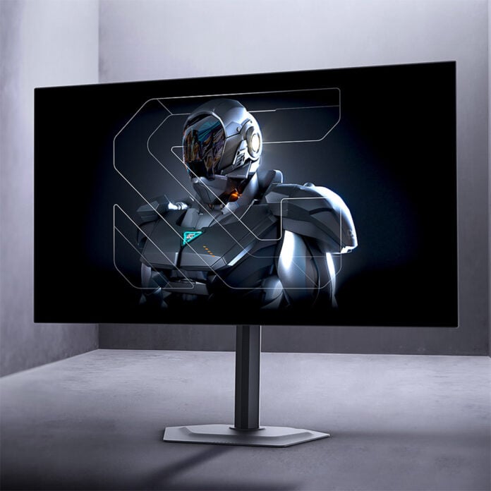 A Gigabyte OLED monitor, standing against a grey backdrop.