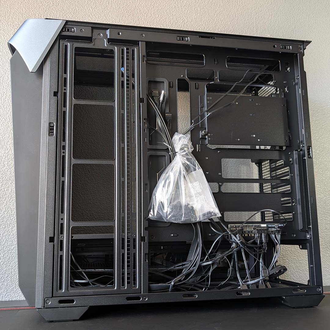 A bottom-up view of the InWin Covalent, panel removed, showcasing default cable management.