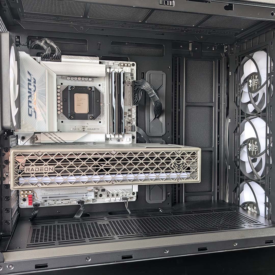 The inner chamber of the InWin Covalent, with motherboard, processor, RAM, and graphics card installed, with cabling.