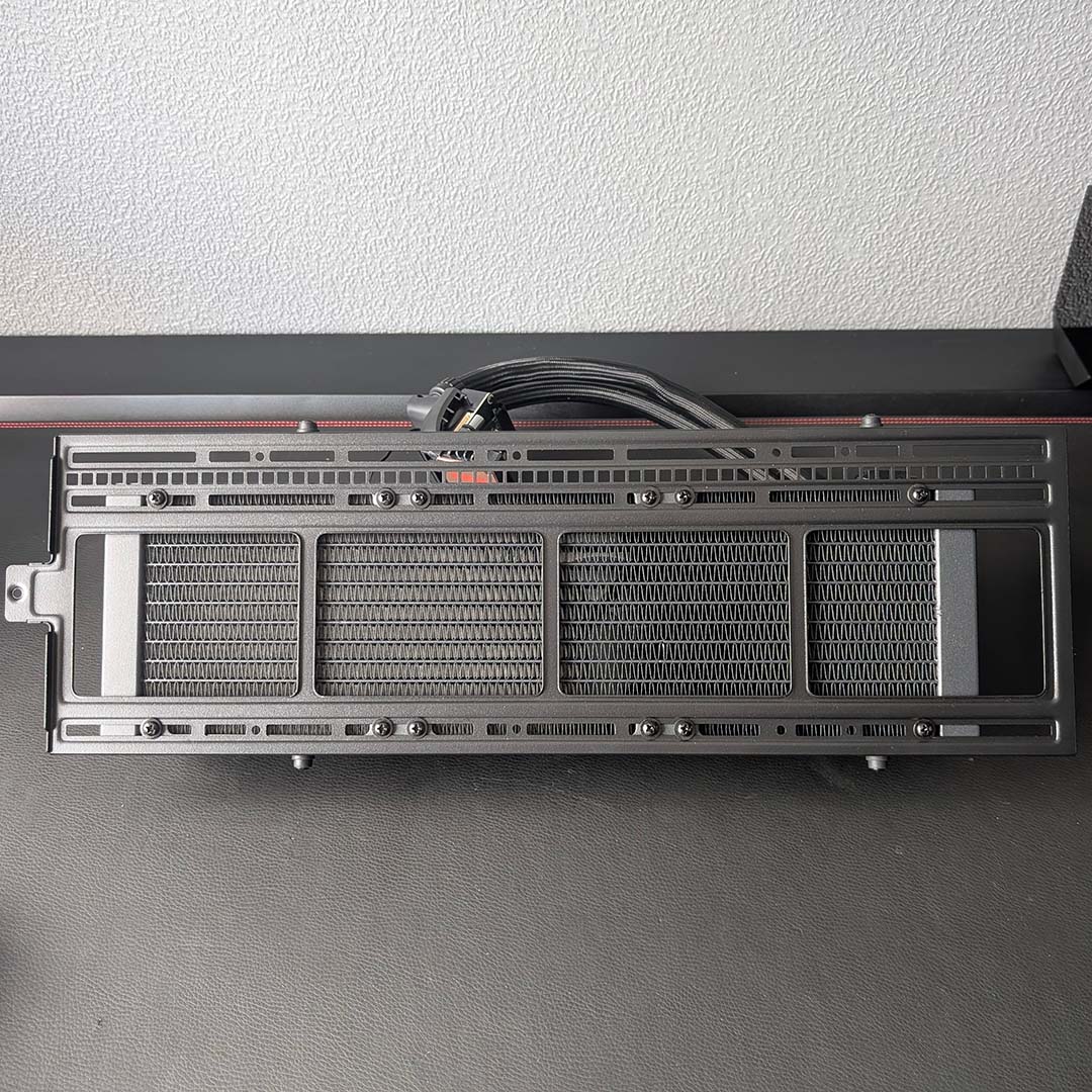 The InWin Covalent's top panel, removed, with a 360mm AIO water cooler screwed on.