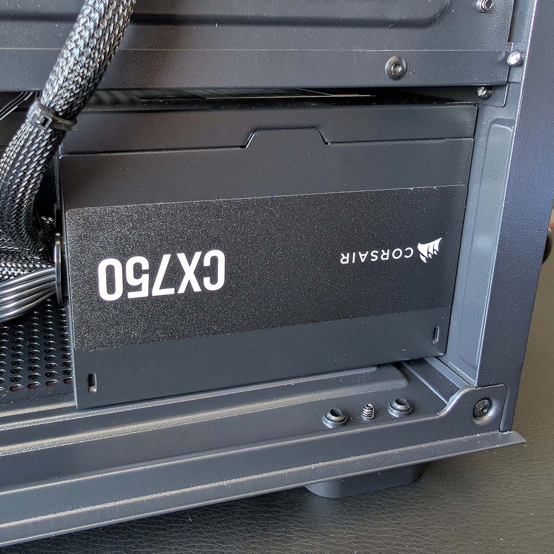 The Corsair CX750 power supply inside the PCSpecialist Apex Ultra.