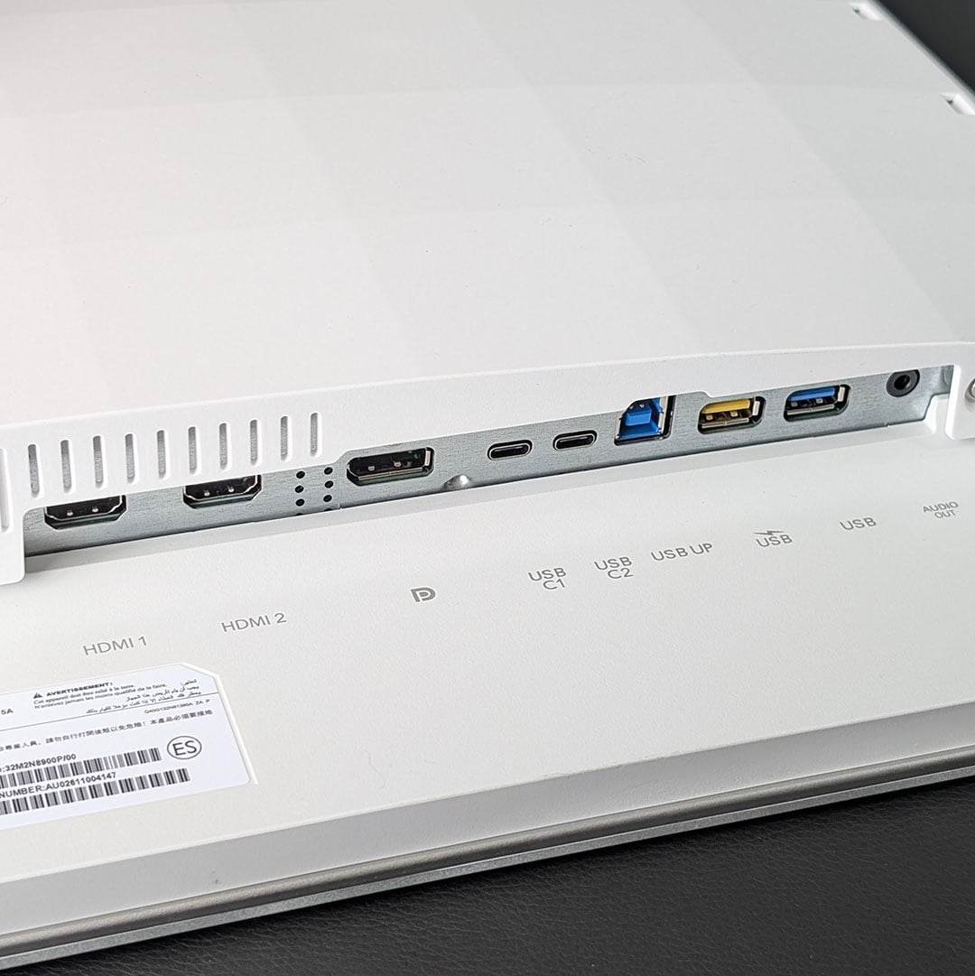 Ports on the underside of the Evnia 32M2N8900P's chassis.