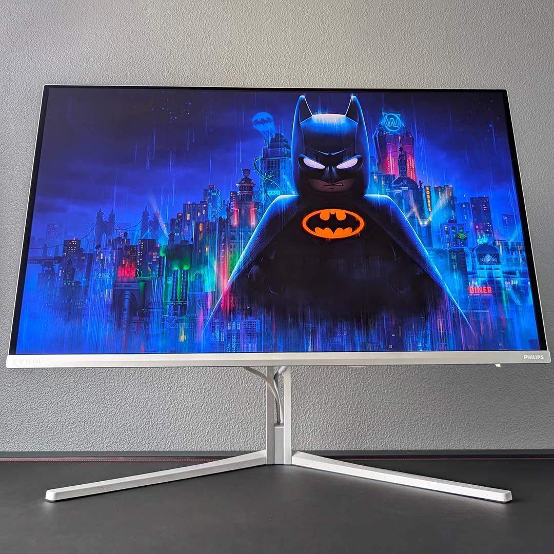 The Evnia 32M2N8900P displaying key art from Lego Batman: Legacy of the Dark Knight.