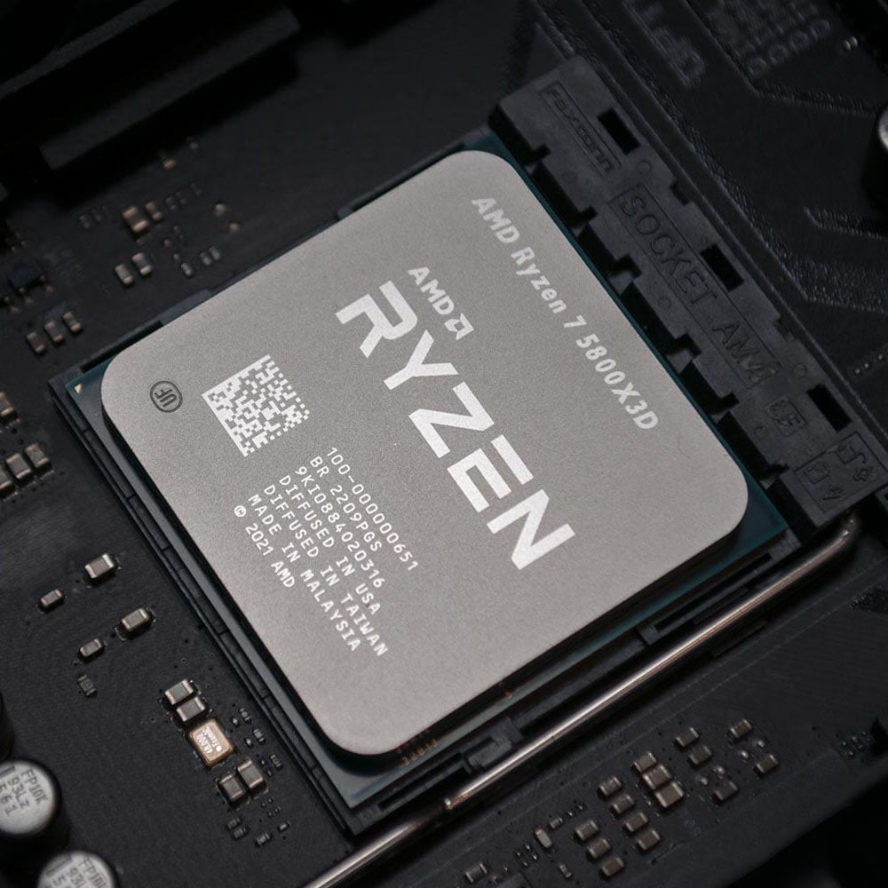 A Ryzen 7 5800X3D sits in its CPU socket.