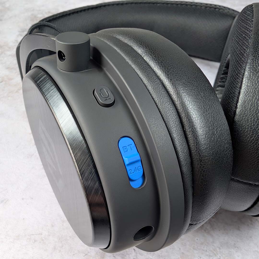 A close-up of controls on the Endorfy Viro Wireless's left earcup.