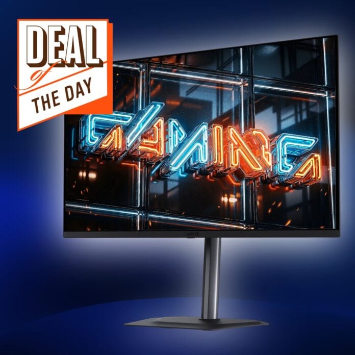 A Gigabyte MO32U24 monitor, standing against a blue backdrop and surrounded by a white glow, with a 'Deal of the Day' symbol above it.