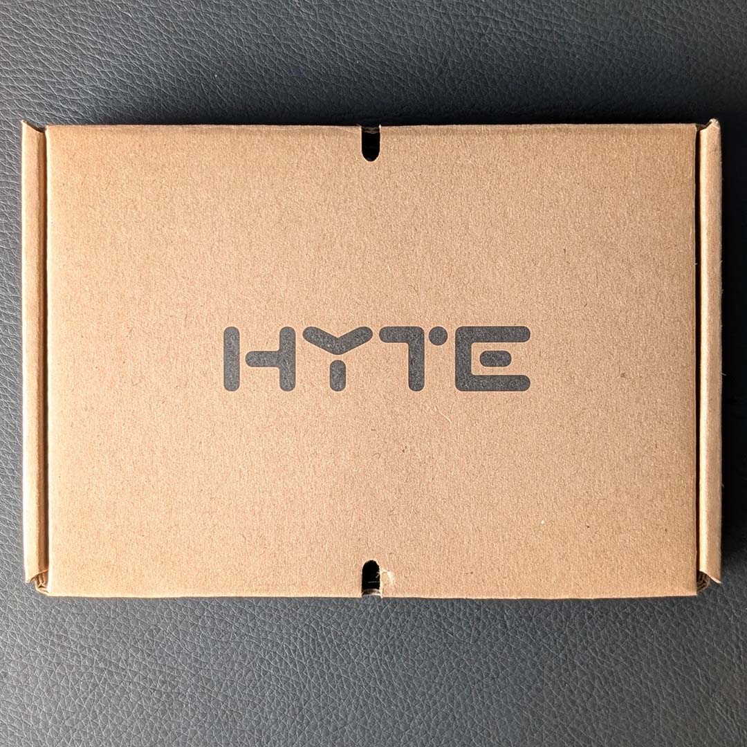A top-down view of the cardboard box cotaining the Hyte Y50 RGB's accessories.