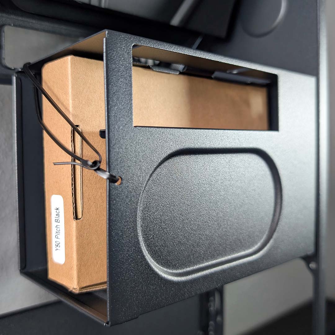 The 2.5/3.5in caddy for the Hyte Y50 RGB, with accesssories inside.