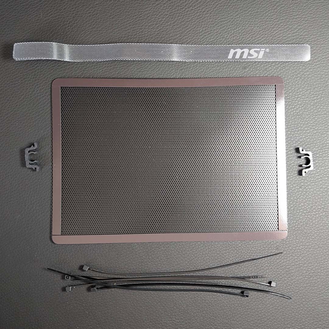 A top-down view of accessories that come with the MSI MPG Vixta 300R PZ.