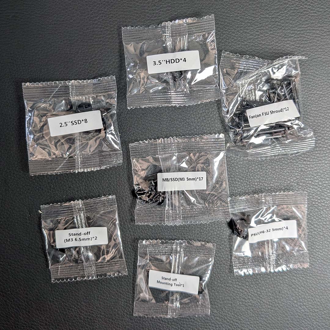 A top-down view of screw bags that come with the MSI MPG Vixta 300R PZ.