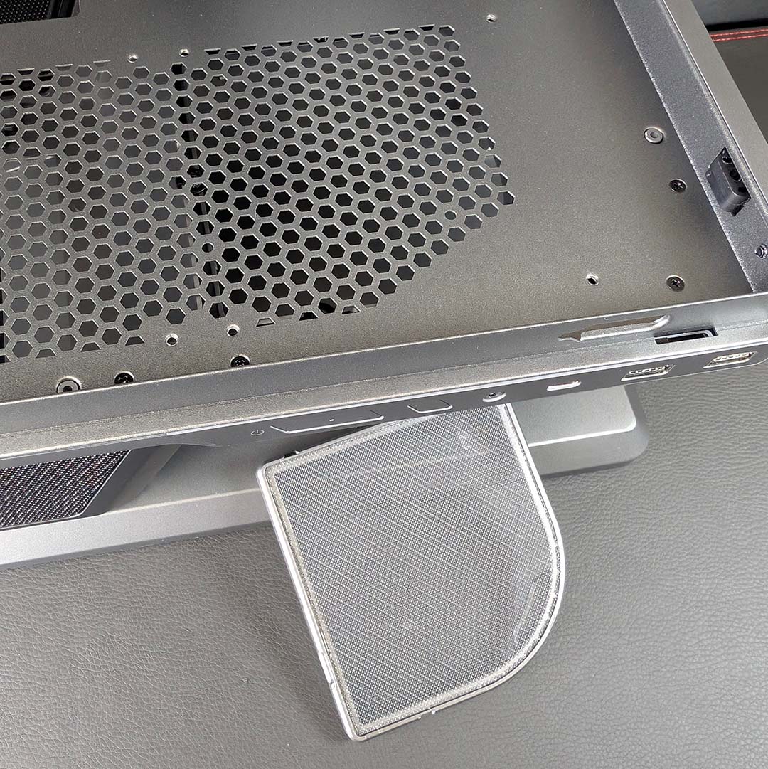 A top-down view of the MSI MPG Vixta's removable mesh filter for the bottom fan.
