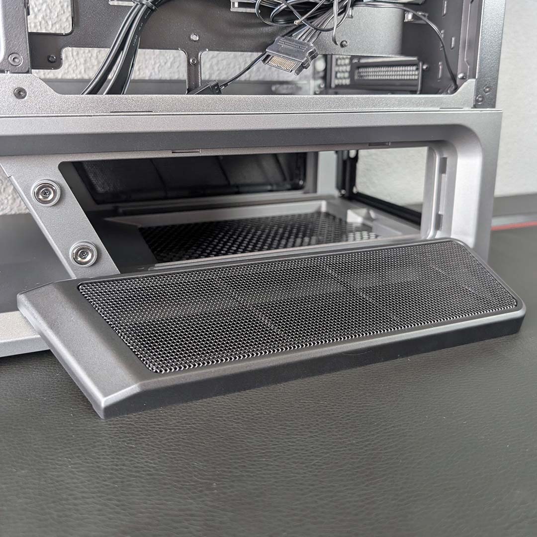 A close-up of the removable power supply chamber covers on the MSI MPG Vixta 300R PZ.