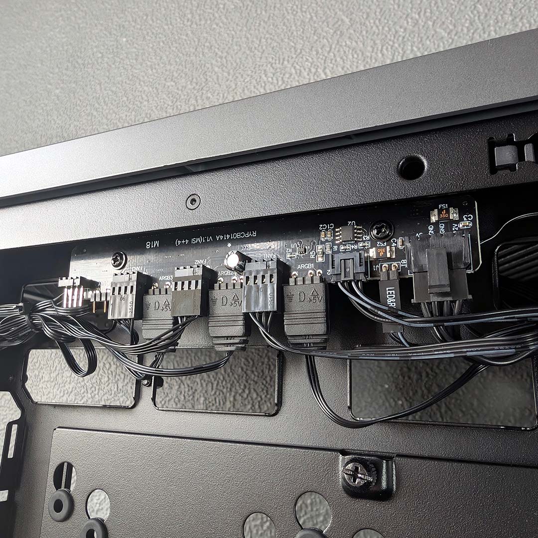 A close-up of the fan and A-RGB controller that comes with the MSI MPG Vixta 300R PZ.