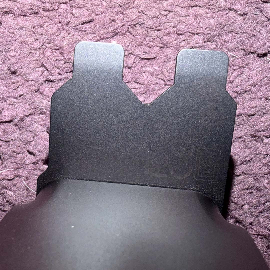 A close-up of a GeForce RTX 50's PCIe teeth, in which the serial number has faded.