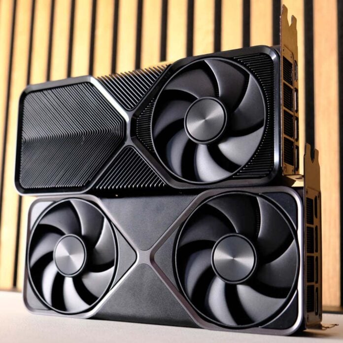 Two Nvidia GeForce graphics cards stacked on top of one another.