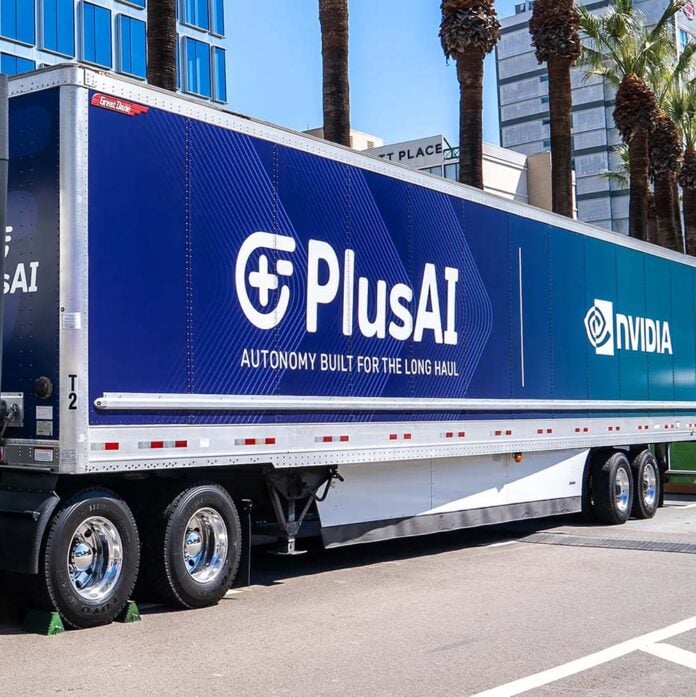 A trailer, covered with PlusAI and Nvidia branding.