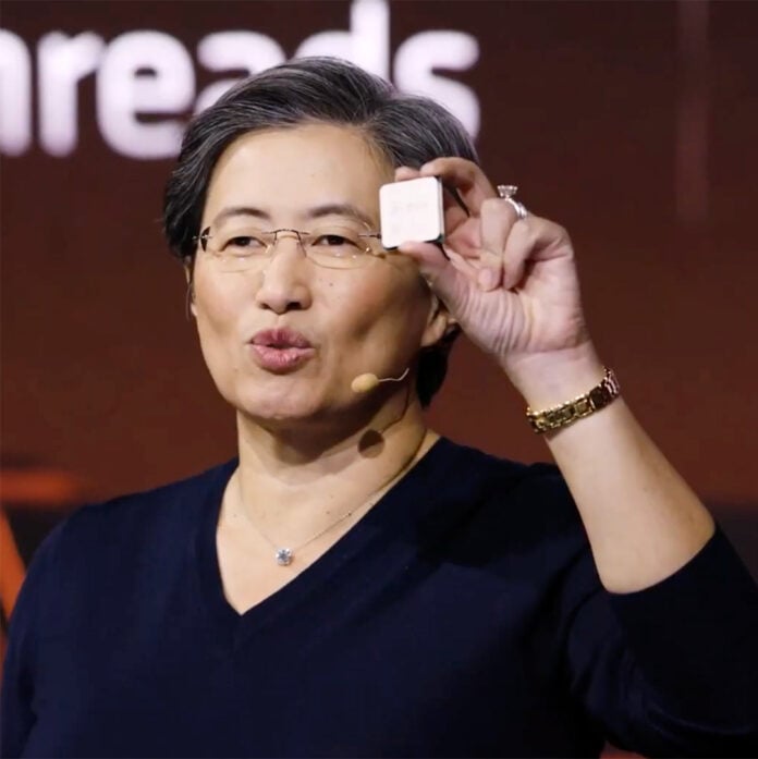 AMD CEO Lisa Su holding an AM4 CPU.