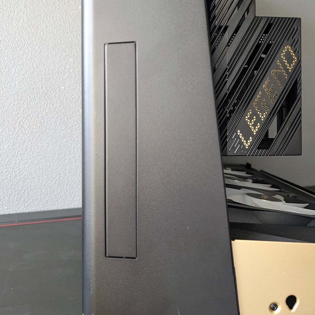 The side of the MSI MEG Maestro 900R, with a plastic cover over where the USBs could sit.