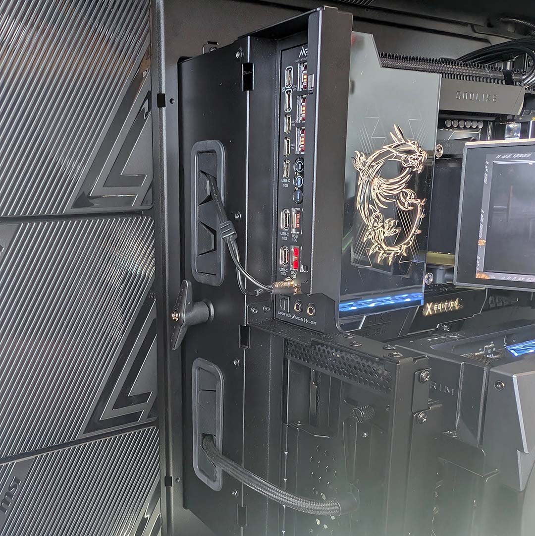 A close-up of WiFi cables and Display cable running to components in the MSI MEG Maestro 900R.