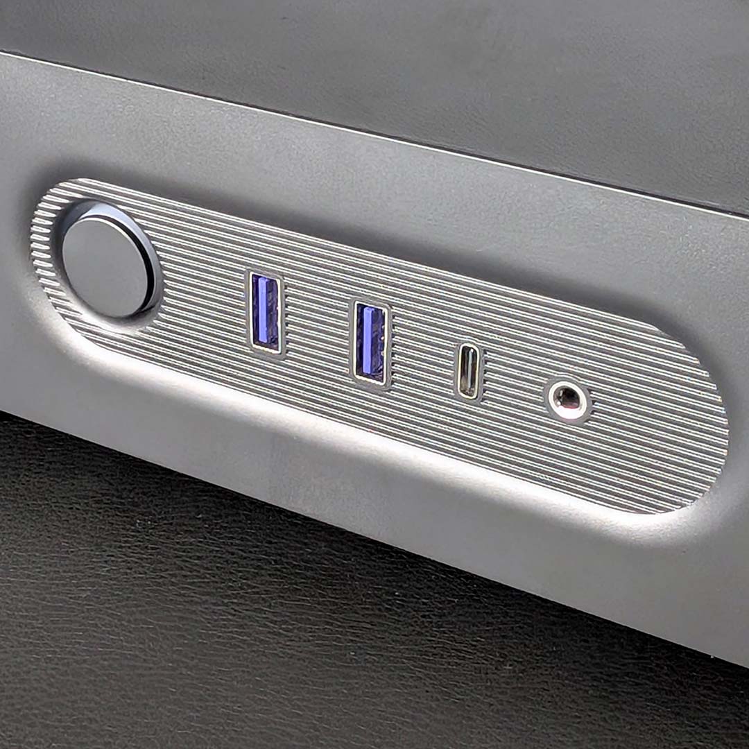 A close-up of the NZXT S5 RGB's front USB ports and other I/O.