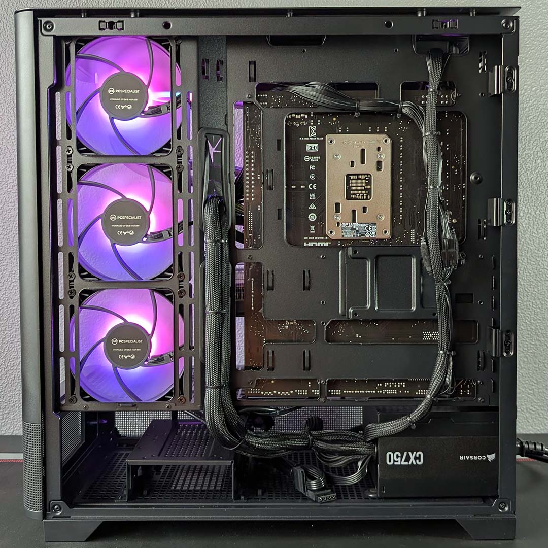 A side view of the PCSpecialist Noble Extreme, panel removed, cables showing.