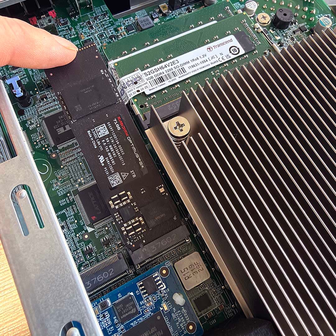 QNAP TVS-h874T NAS with a SanDisk Optimus GX 7100 SSD